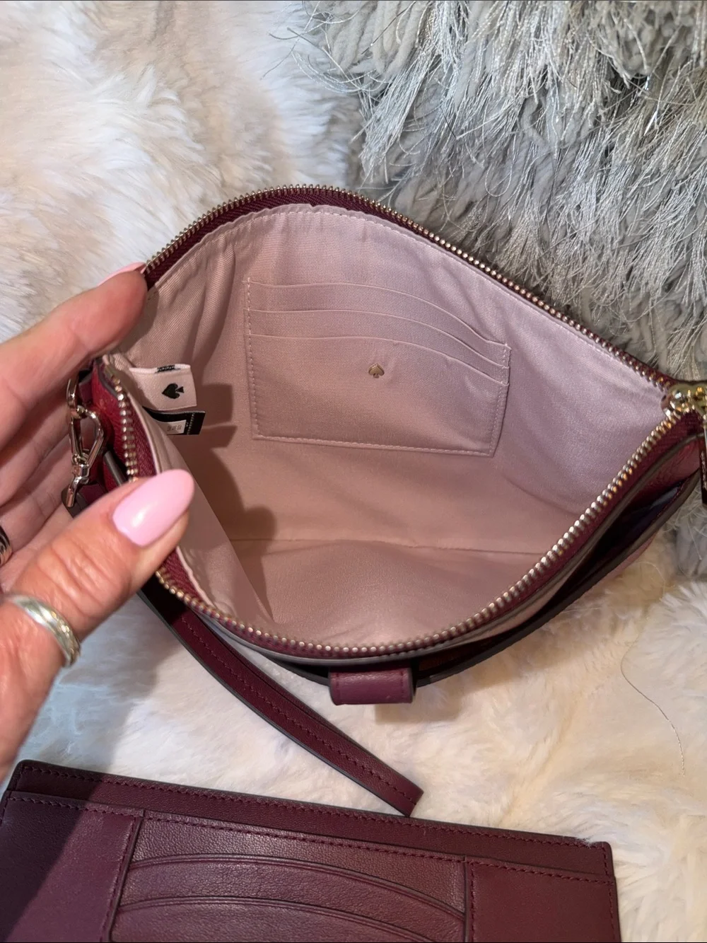kate spade Burgundy Pebbled Leather Wristlet Clutch with Gold Tone Logo